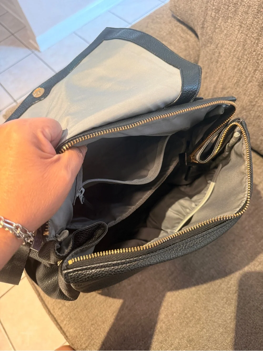 FP Black Leather Fold-Top Backpack with Gold Accents